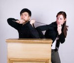 man & woman struggle over mic iStock_000001361410XSmall